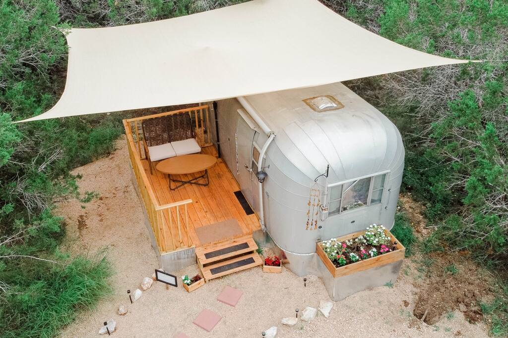 Moon Dancer Vintage trailer (queen bed and full size futon).  Has full detached bathroom. 