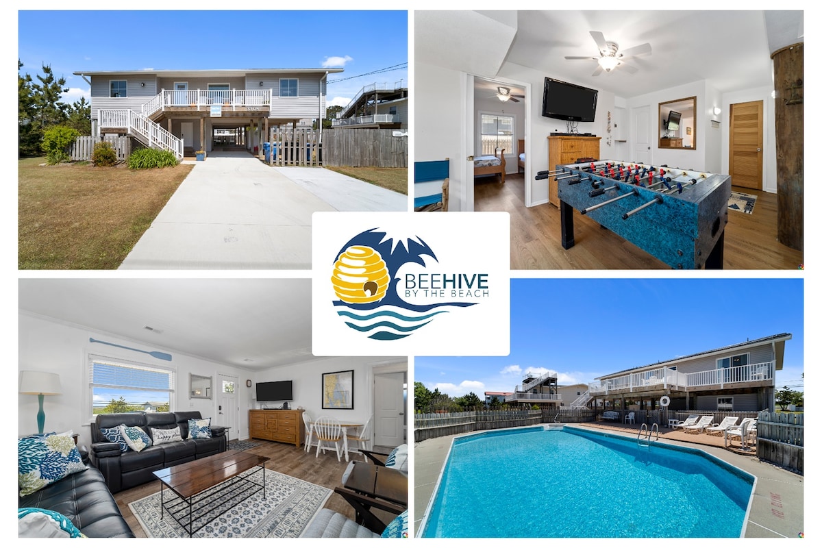 The exterior of the Beehive by the Beach features a welcoming entrance with ample parking space. Inside, a comfortable living area is shown with a spacious sectional sofa and a television. A games table offers entertainment options. The private heated pool area is visible, showcasing lounge chairs and a relaxing atmosphere.