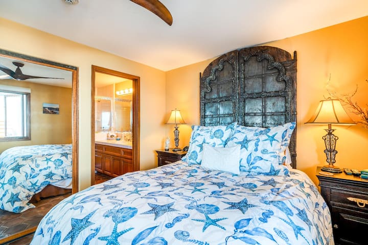 Guest suite has an attached bathroom and ocean view. 