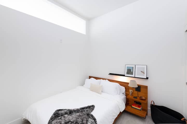 Rest easy in the comfy queen bed with premium linens for a perfect night’s sleep