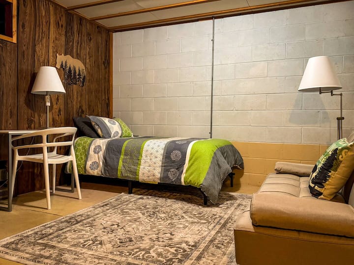 Workspace & Twin bed. Nothing fancy here, but quiet and comfortable. Cool in summer & warm in winter.