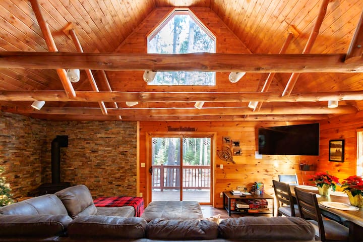 Open Living Room | Gas Fireplace | Great views of the woods | Super comfortable sectional couch w/ Queen sleeper | 50" TV
