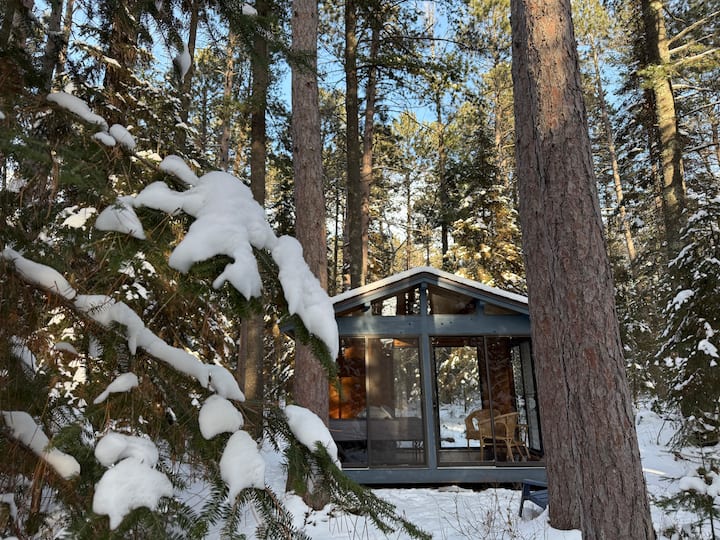 The Glass House is open May-October | It's fun to hike through the woods and visit in Winter | Follow the trail past the Secret Glass House sign behind the cabin!