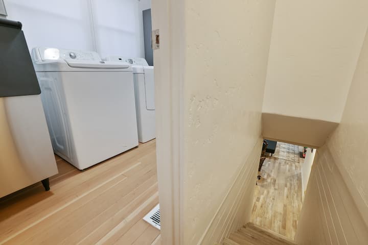 Stairs leading to third bedroom is just off of the laundry room. 