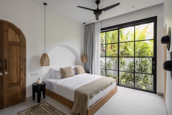 Guest bedroom with a king-size bed.