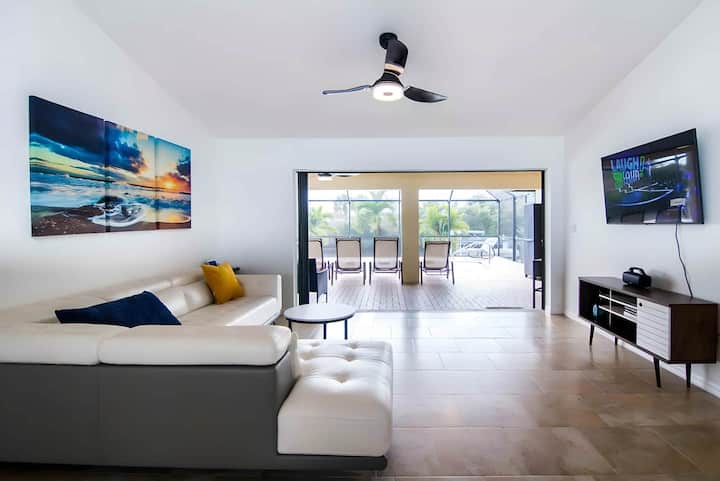 Seamless indoor-outdoor living! Relax in style and step right out to the pool for the ultimate waterfront retreat.