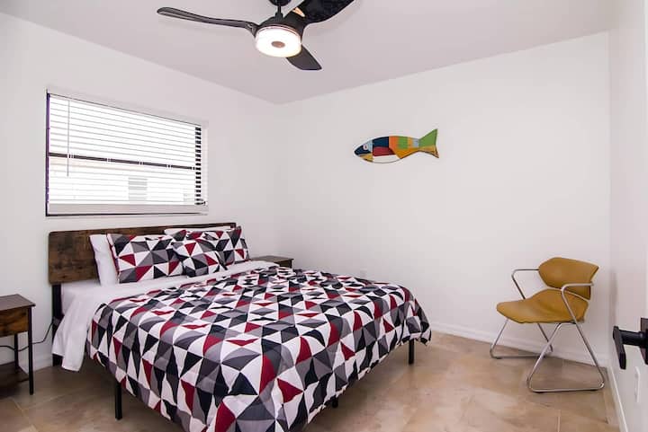 Bright, cozy, and ready for a restful night's sleep—this charming third bedroom brings a splash of fun and comfort.