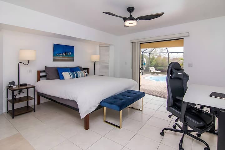Wake up to poolside views in this luxurious master suite—perfect for both relaxation and remote work with style.