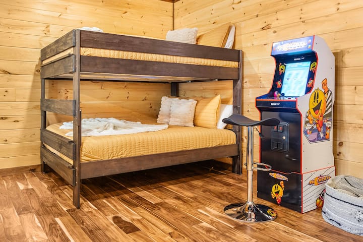 Lower Level: Two Queen size beds that can sleep four, with arcade games and infinity table