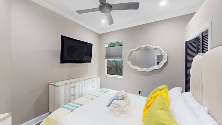 Bright guest room offering calm, airy vibes.