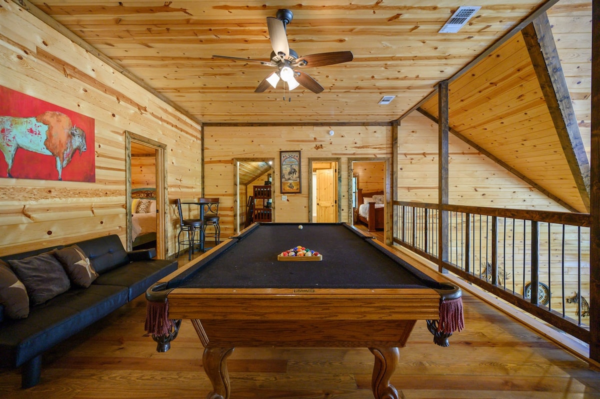 The gaming loft includes a pool table, arcade game, infinity table, board games and a sleeper couch