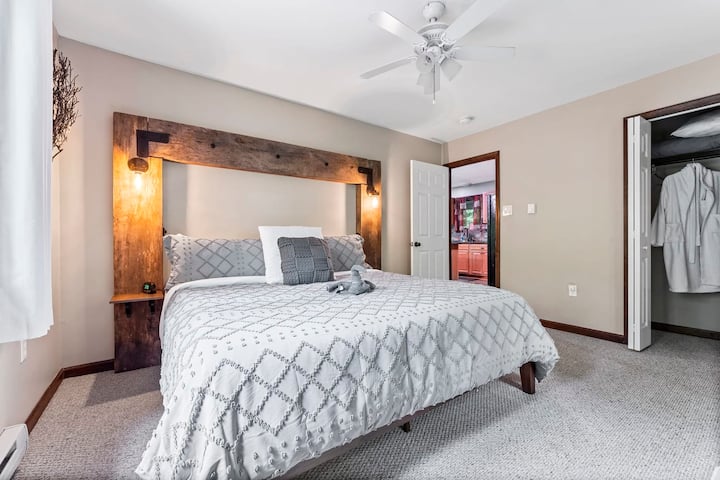 Indulge in the ultimate comfort and luxury in our stunning master bedroom. The centerpiece of the room is a beautiful custom-made headboard, crafted with care to ensure the perfect blend of style and comfort. The spacious room offers plenty of room 