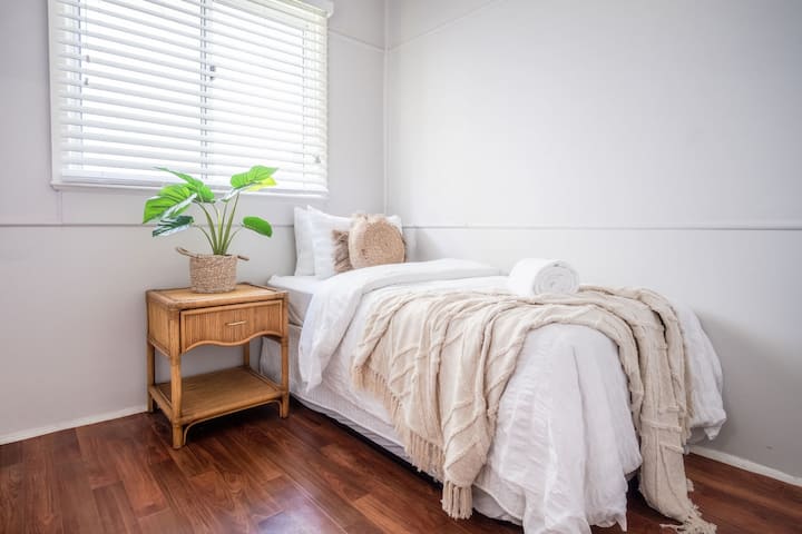 Bedroom three is located at the back of the house and features one single bed.