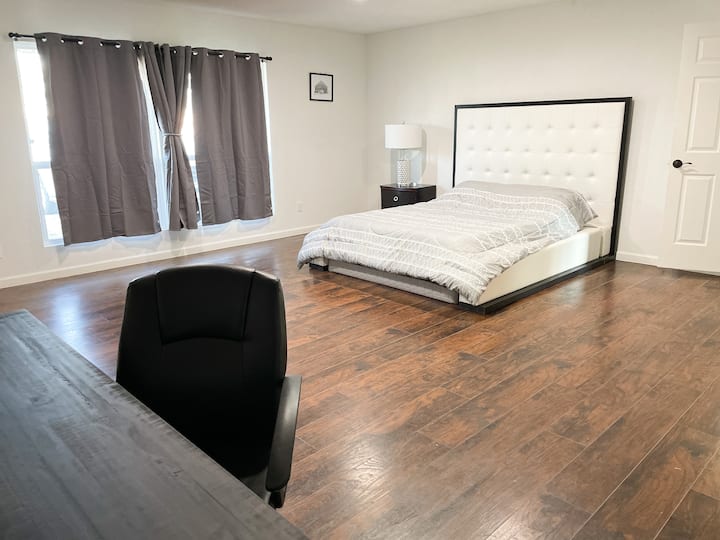 Bedroom 1: Stylish King Suite with Office Space!