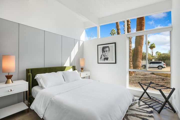 Comfortable queen bedroom with Smart TV and closet space.