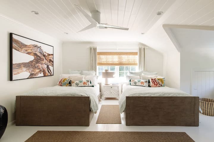 This second-floor bedroom has two queen beds, a large closet, and lots of room - perfect for teens or friends of the family. The bathroom is across the hall and is shared with Bedroom 5,