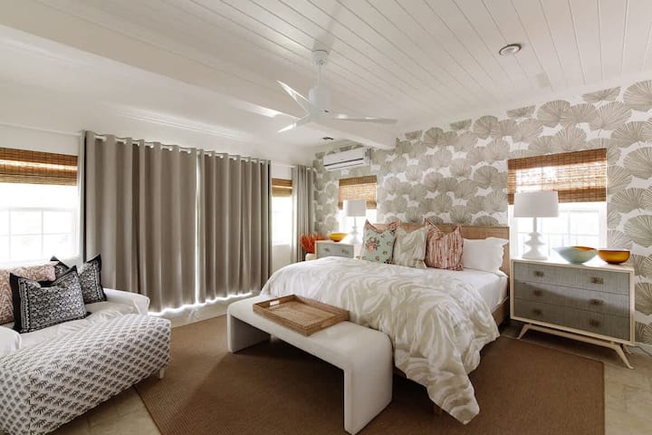 This bedroom is on the main floor, comes with a king bed, and plenty of space to spread out. It has its own bathroom and has direct access to the pool and patio.