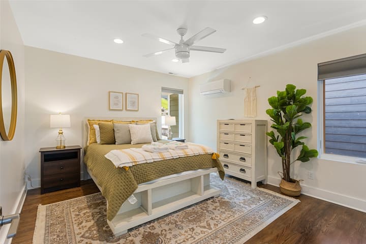Upstairs queen bedroom with a bench
