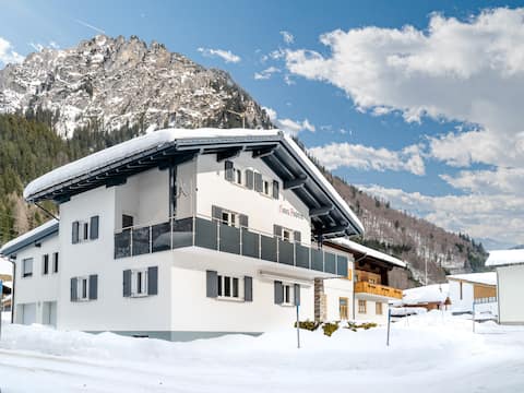 Apartment with terrace surrounded by mountains