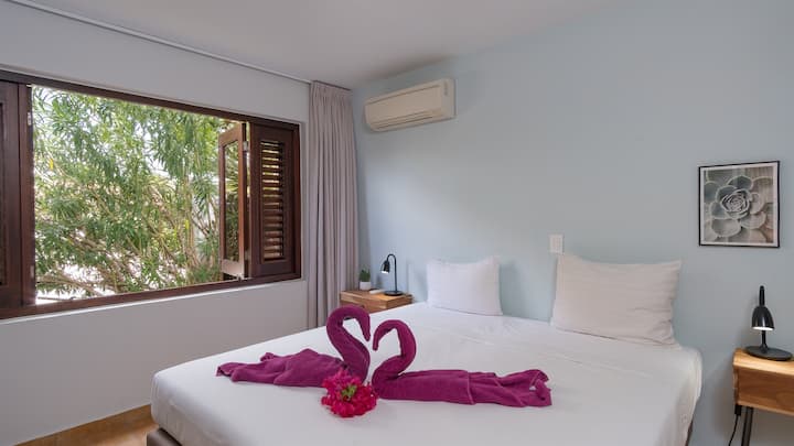 The second guest bedroom has A/C and armoire. It is towards the front of the house.