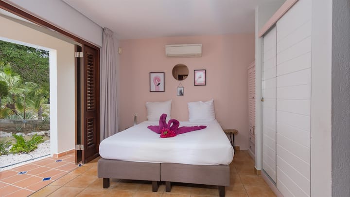 First guest bedroom has A/C and armoire.