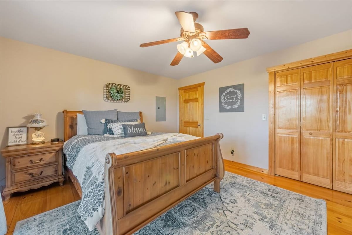 Bedroom 1 in Muse's Mountain Lodge cabin. With a queen-sized bed.