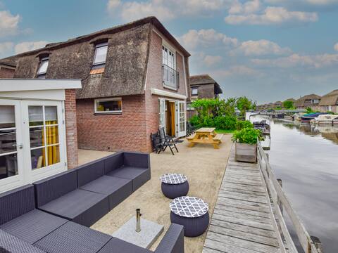 Holiday home with waterside terrace
