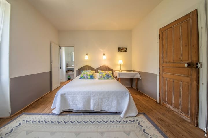 Bedroom with double bed and ensuite bathroom