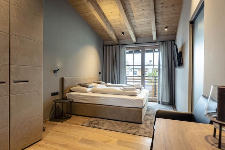 Example: Bedroom - penthouse Kröndl with fireplace