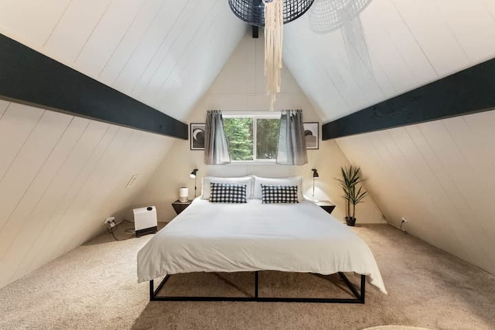 The King bedroom dramatically expresses the A-Frame architecture.
