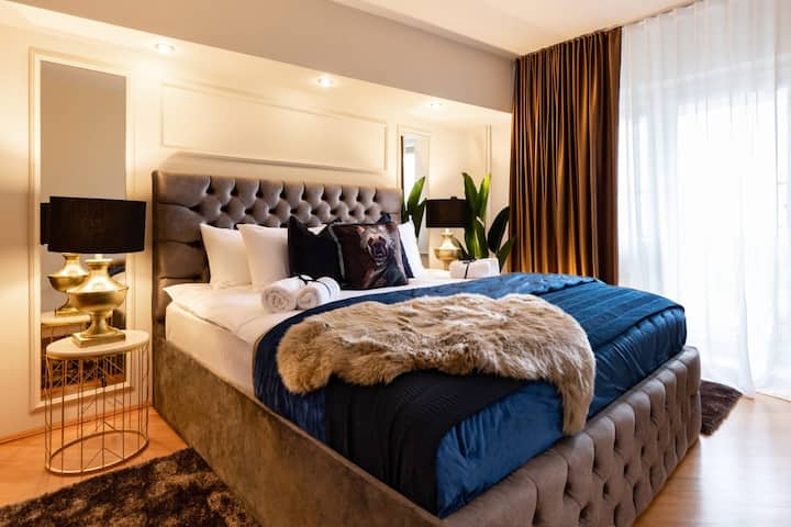 Embrace the charm of our sun-kissed bedroom, where natural light dances through the windows, illuminating the elegant decor and creating an atmosphere of refined comfort.