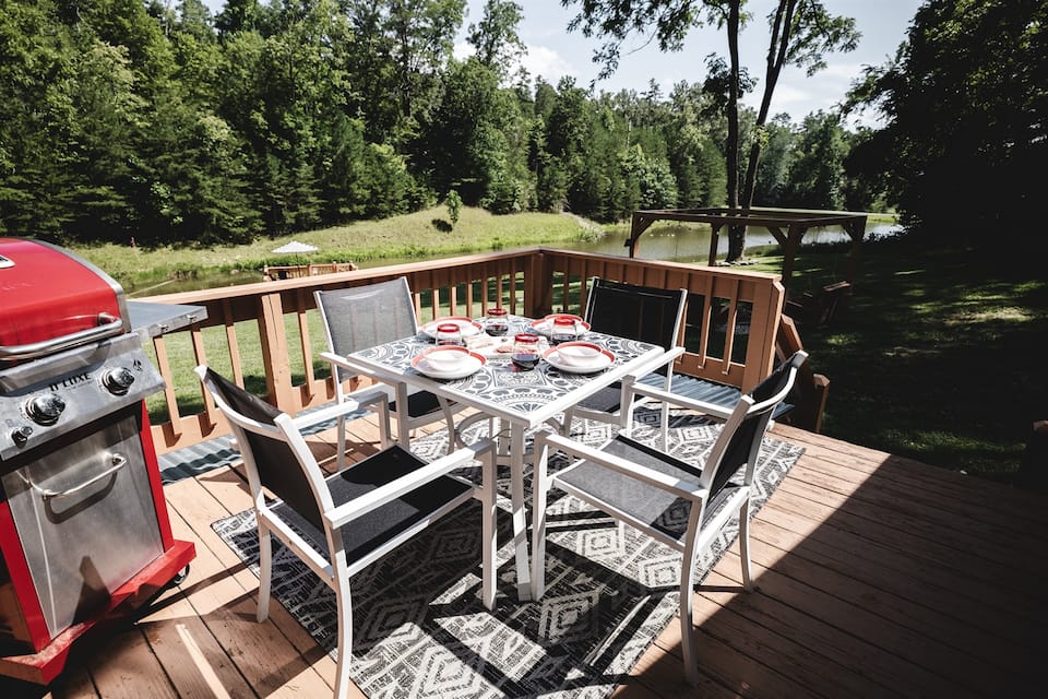 Dinner on the deck, yard sloping right down to the water