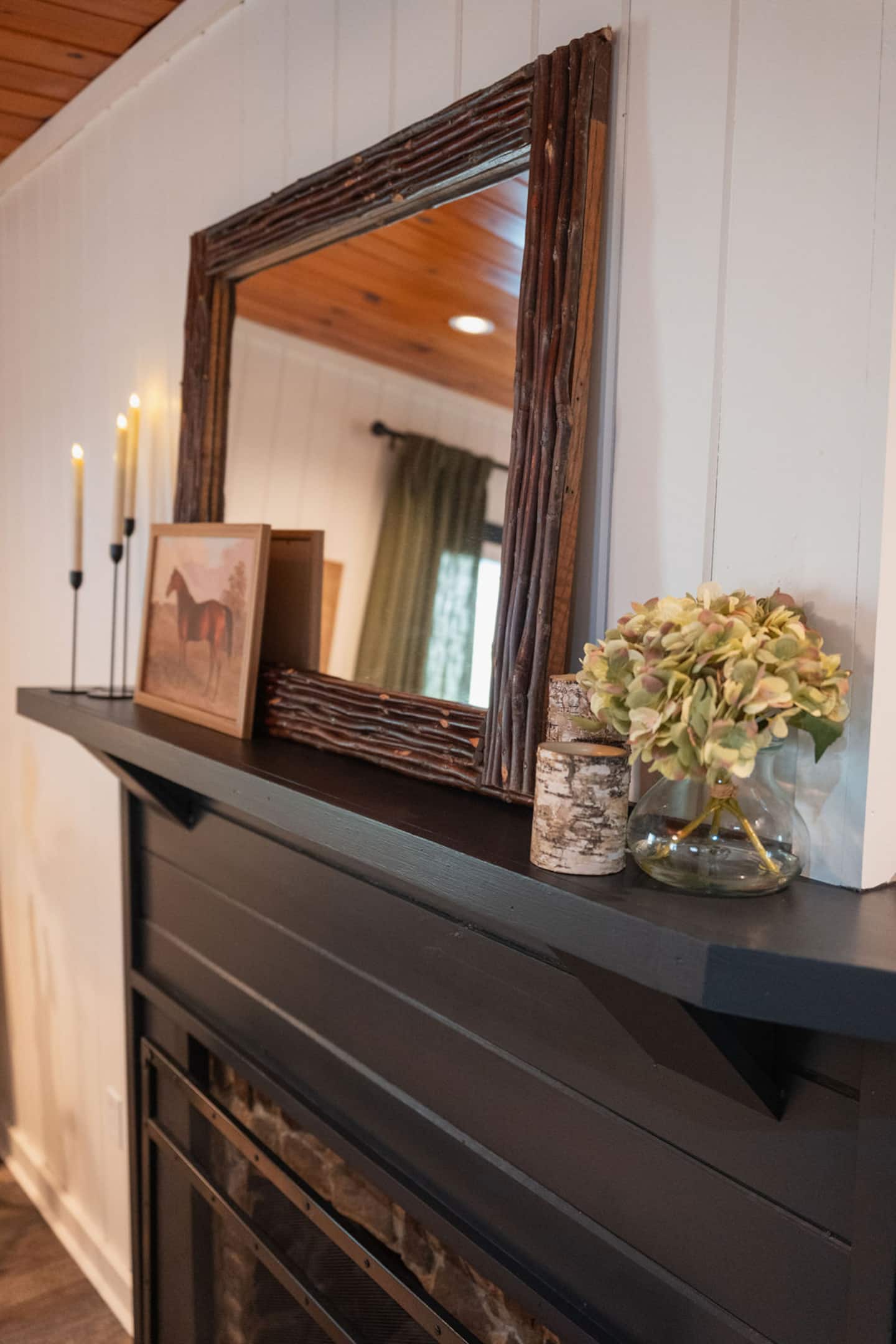 Light a taper candle at the mantel and let the little touches set the mood.