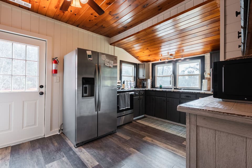 The fully stocked kitchen under a vaulted ceiling