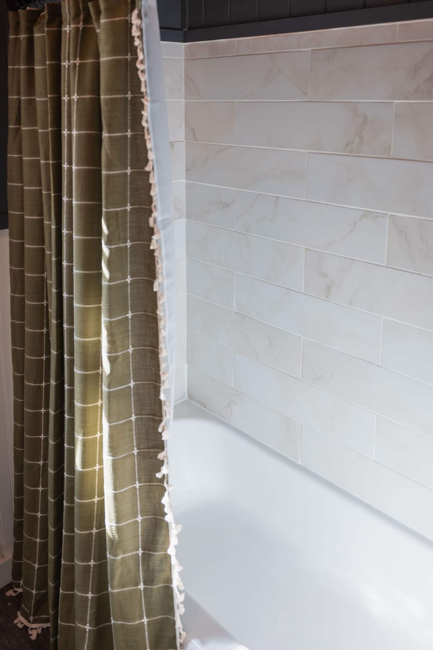 Draw the shower curtain and rinse off in the refreshed tub surround.