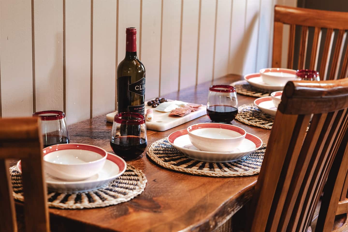 Set the table with the cheese board and a bottle of wine for a slow, unhurried dinner.