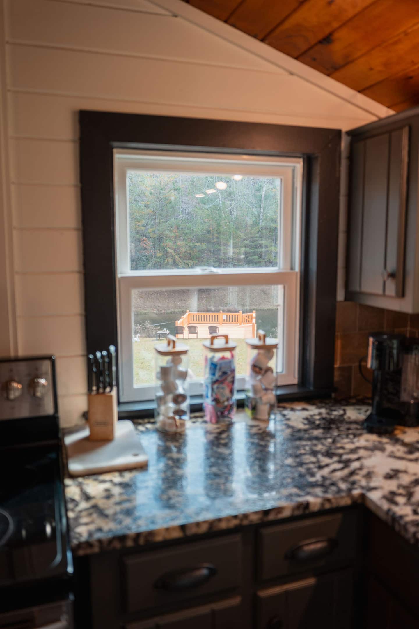 Wash up at the sink and catch the pond glimmering just past the window.