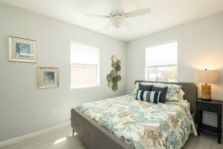 This guest bedroom #1 has a comfortable queen size bed and a view to the pool. 