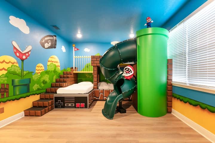 Celebrate the season in style with our Super Mario-inspired room—bursting with vibrant spring colors and playful details, including a charming slide, perfect for creating joyful family memories this season.