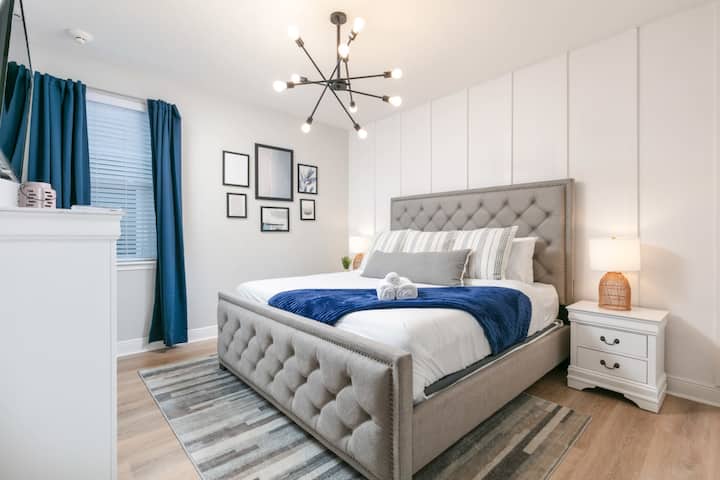 Enjoy a spring escape in our luxurious second-floor king bedroom!  With plush bedding and peaceful decor, this spacious retreat is perfect for unwinding and recharging during your stay.