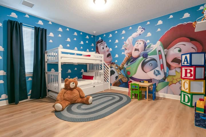 Share this triple bunk room with your favorite cowboy and space ranger.