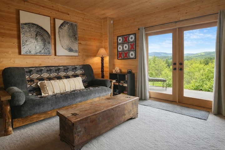 Experience comfort and fun in our basement! With a fold-down couch for extra sleeping space, giant tic-tac-toe for family games, and a view of the mountains right outside the door, relaxation and adventure await in this cozy retreat.