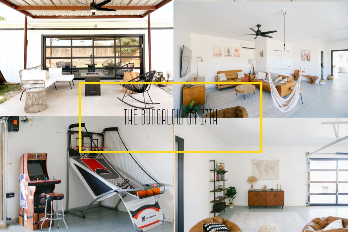 An inviting flex space features an open layout with a mix of seating areas, including a hammock and stylish chairs. A basketball arcade game stands ready for entertainment. Bright sunlight filters through large windows, enhancing the fresh, modern decor.