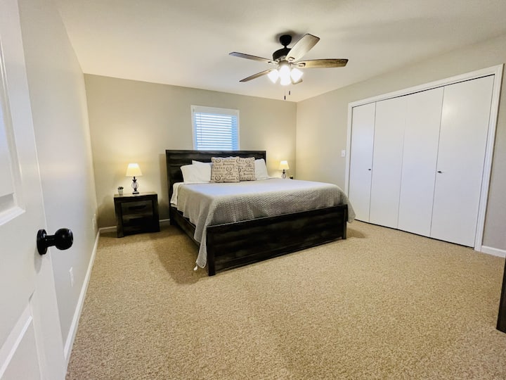 Duplex 1 - Primary bedroom with king size bed and access to the main bathroom from inside the room
