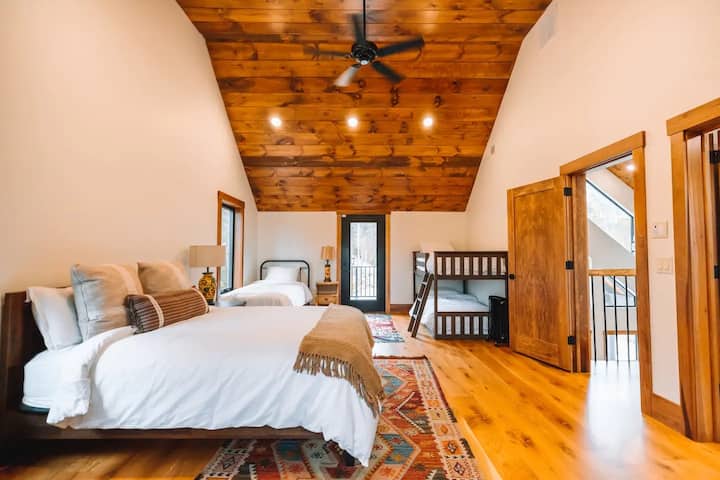 Bedroom #3 on the 2nd floor with 1 queen, 1 full-size, and full-size bunk beds.
