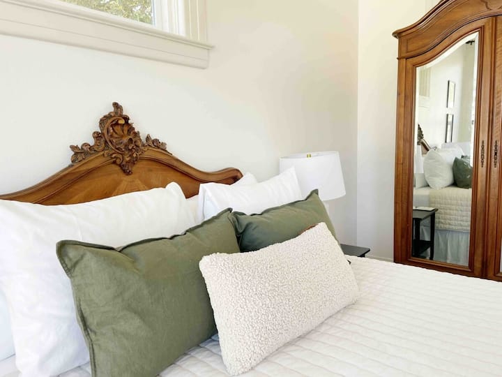 Bedroom 1 is outfitted with beautiful antique furniture
