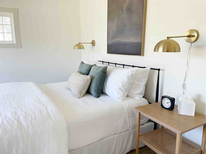 Bedroom 3 is located upstairs and has an unobstructed view of the farmland and hills behind the home.