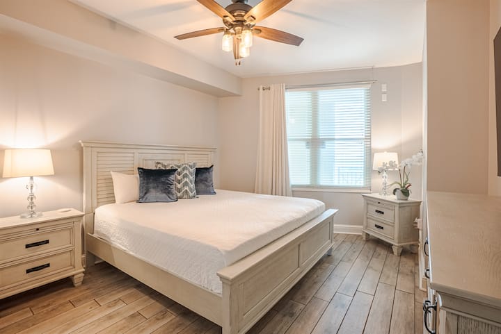 Guest bedroom with a cozy king bed and matching nightstands.