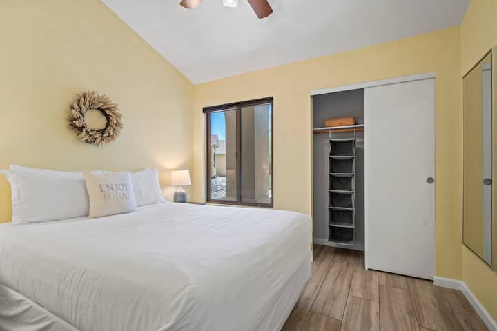 Bask in the warmth of a sunny yellow ambiance, accentuating the comfort of a queen-sized bed. This vibrant combination creates a cozy and inviting retreat.