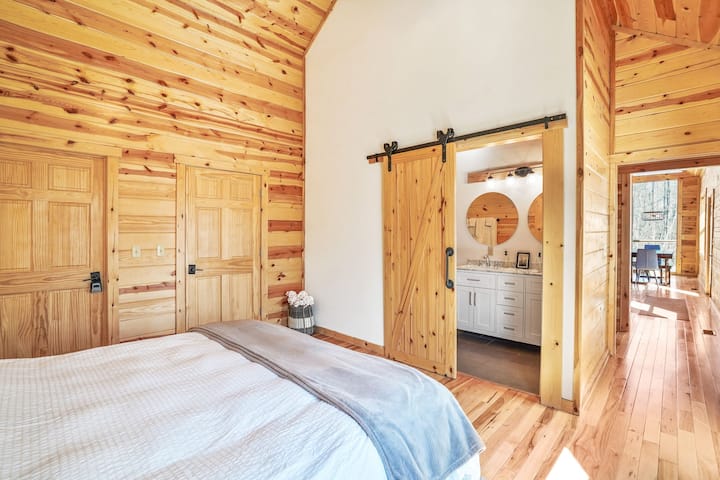Bedroom Retreat: Warm wooden accents and modern charm await for your restful getaway!